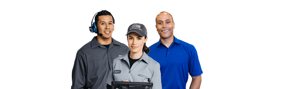 Group of three Penske employees smiling