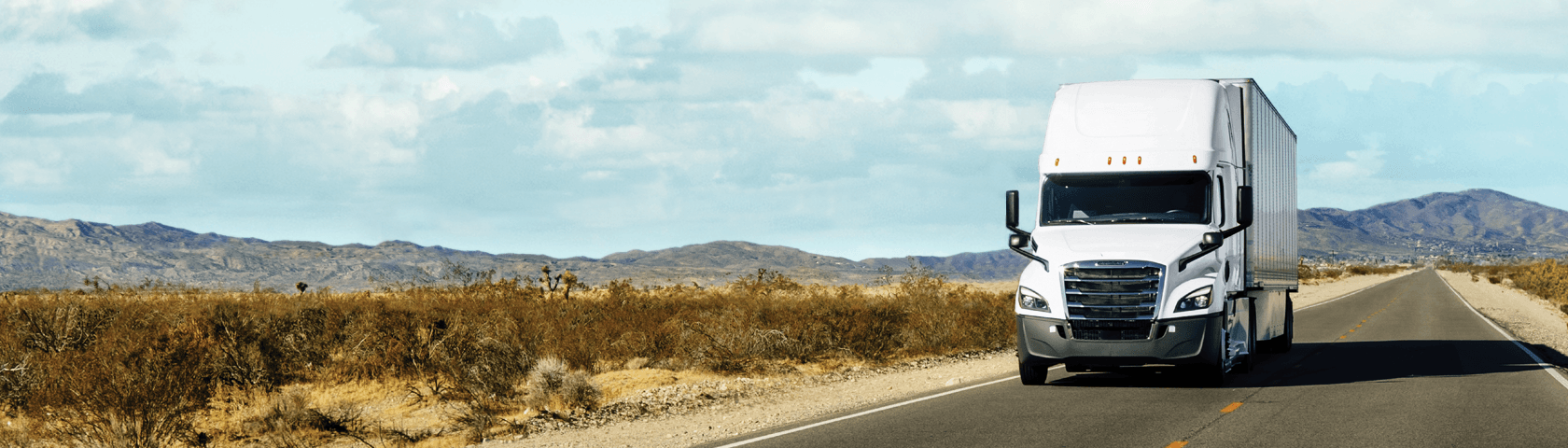 White Penske tractor trailer on a highway
